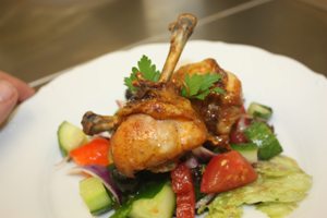 chicken dish arange with vegetable salad